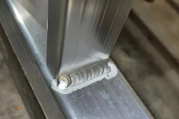 Close-up of a welded joint on aluminium box section